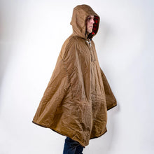 Load image into Gallery viewer, Person wearing a breen hooded poncho against a white background