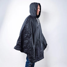 Load image into Gallery viewer, Person wearing a navy hooded jacket against a white background
