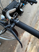 Load image into Gallery viewer, Left grip of handlebar from city commuter bicycle
